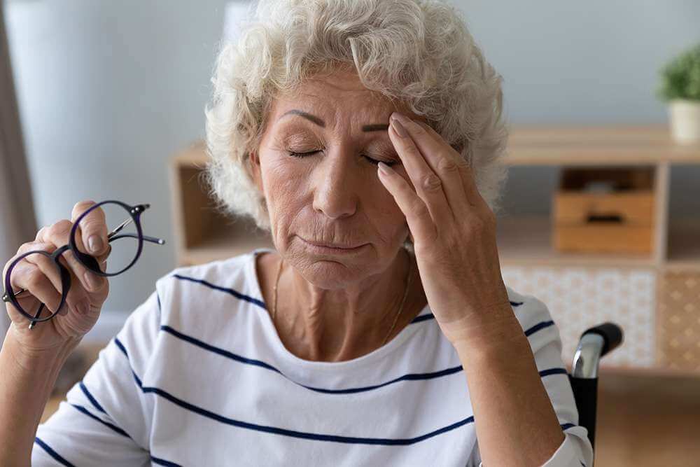 A Old Lady having Headache