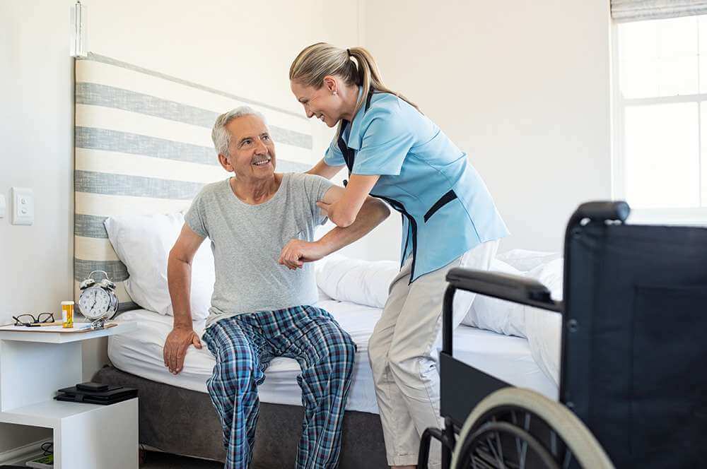 Nurse helping woman at home