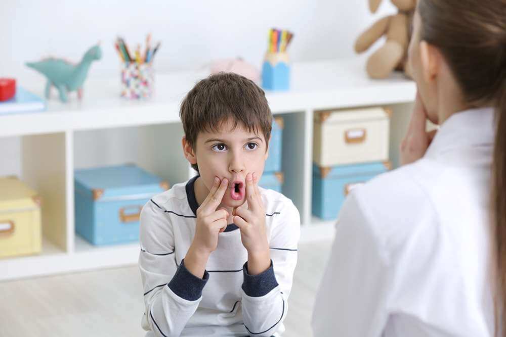 A child with speech therapist