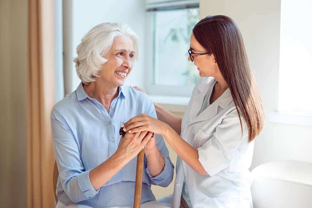 woman getting senior care services at home