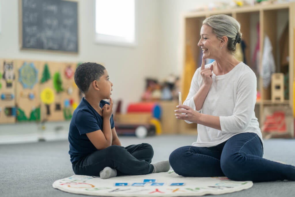 Speech therapist working with patient