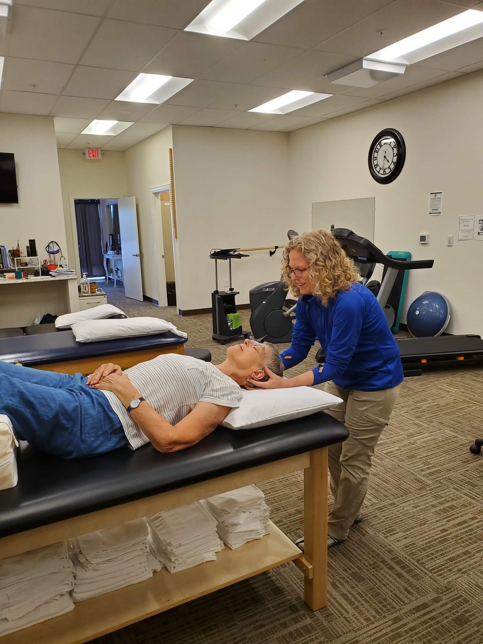 physical therapist working with patient