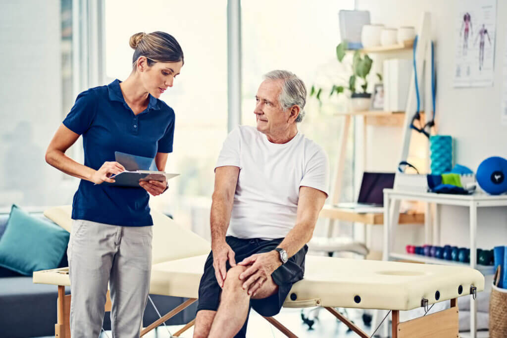 physical therapist talking to patient