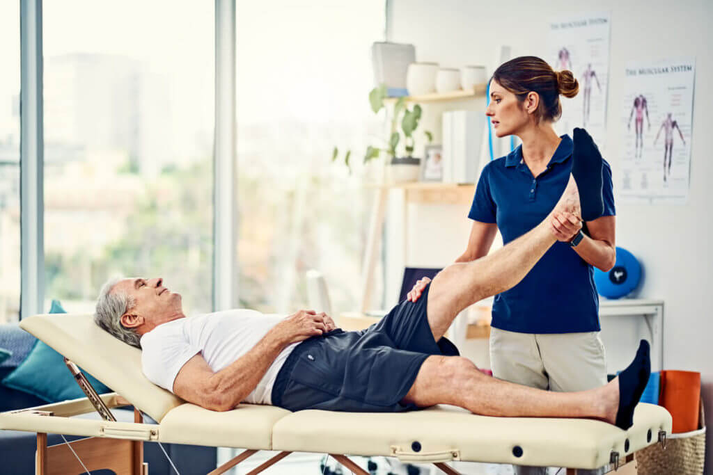 physical therapist treating patient