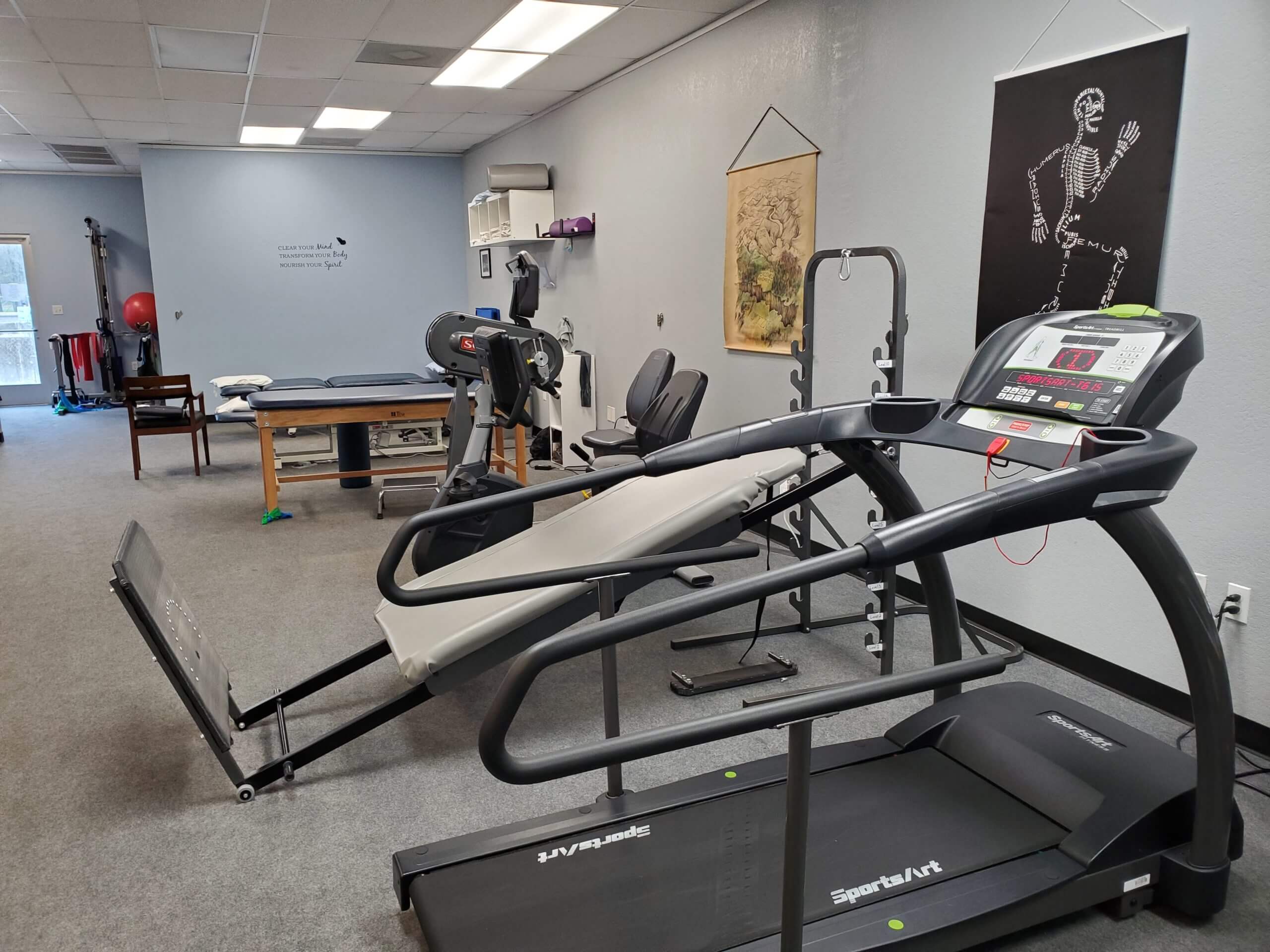 physical therapist exercising woman's arm 