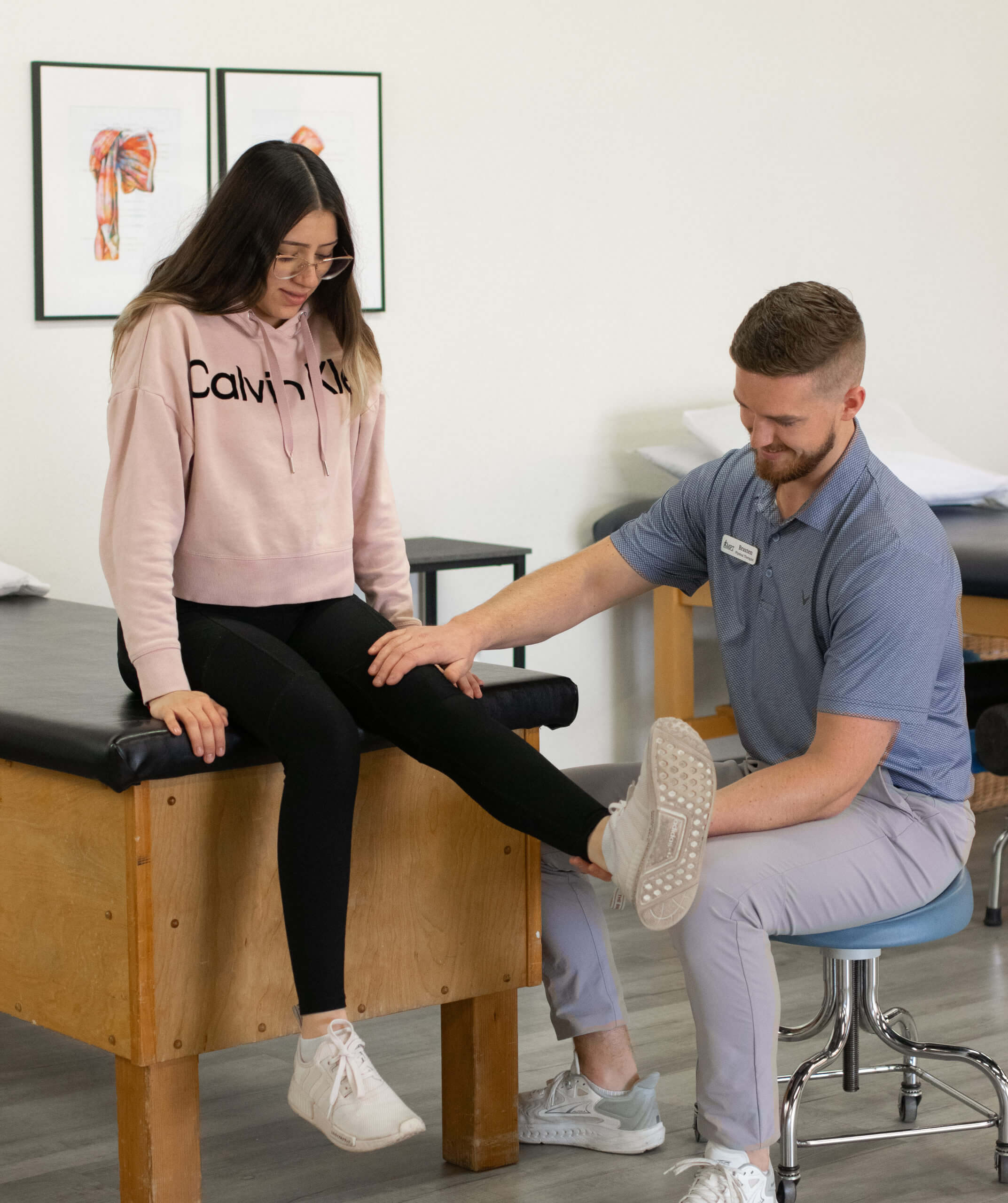 physical therapists working with patient at midland physical therapy