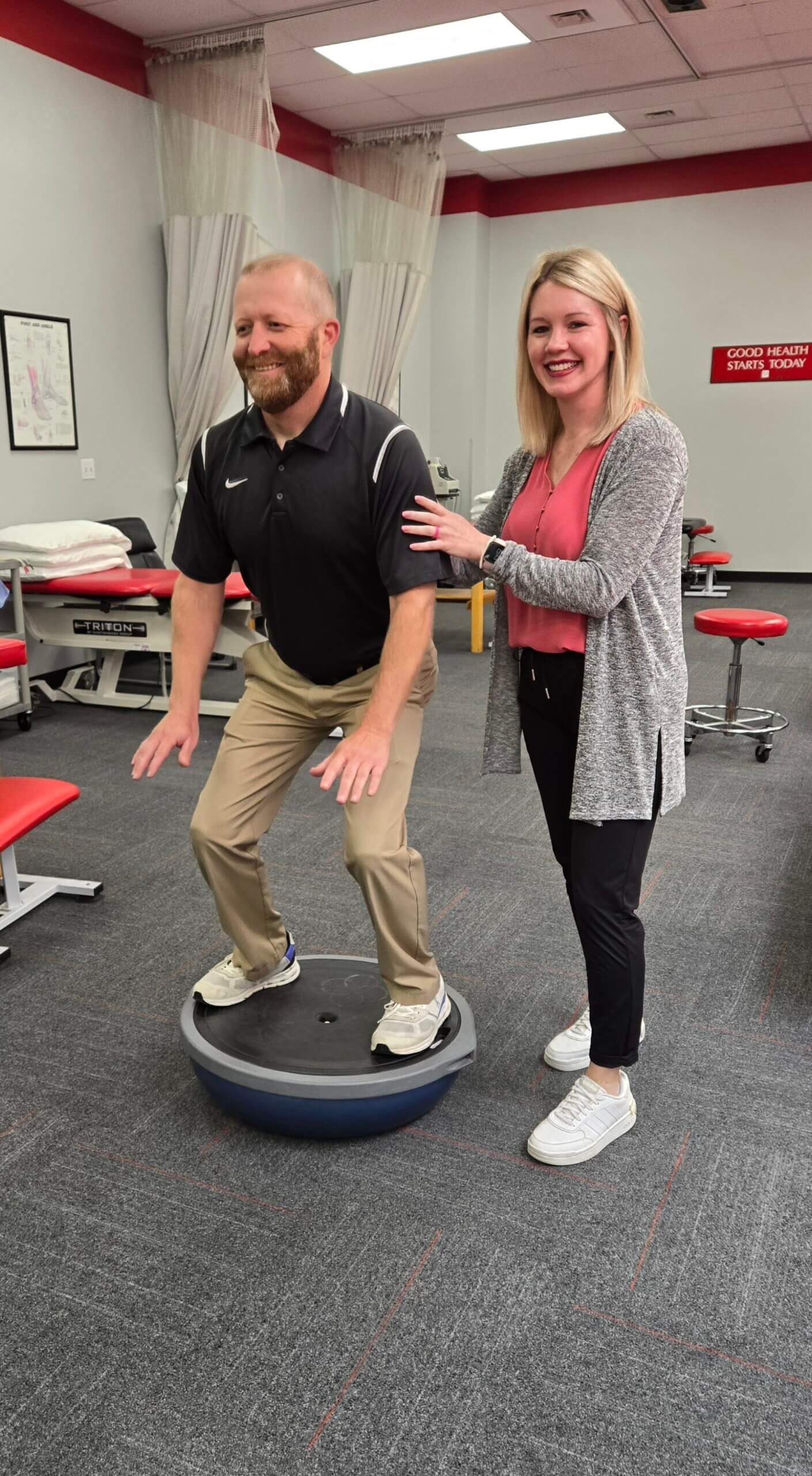 physical therapist working with patient at physical therapy today