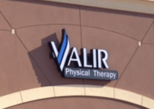 Valir Physical Therapy logo on top of a building