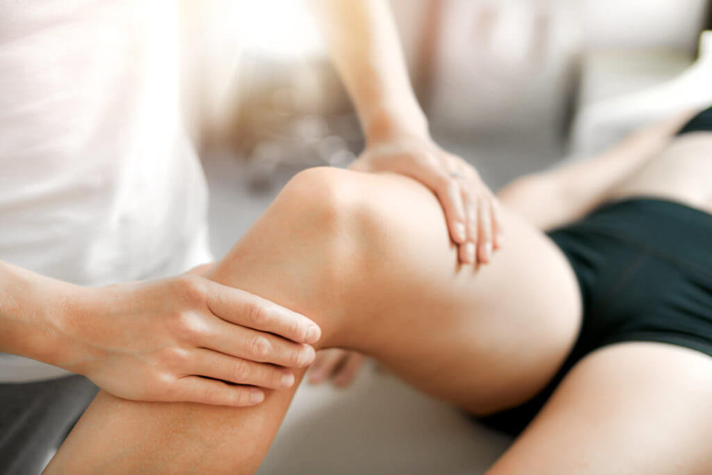 Woman getting physical therapy for her torn meniscus.