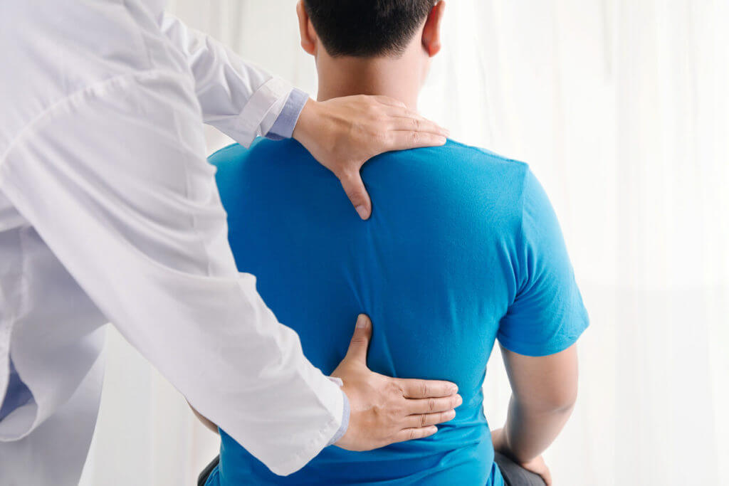 Man getting physical therapy for a herniated disc.